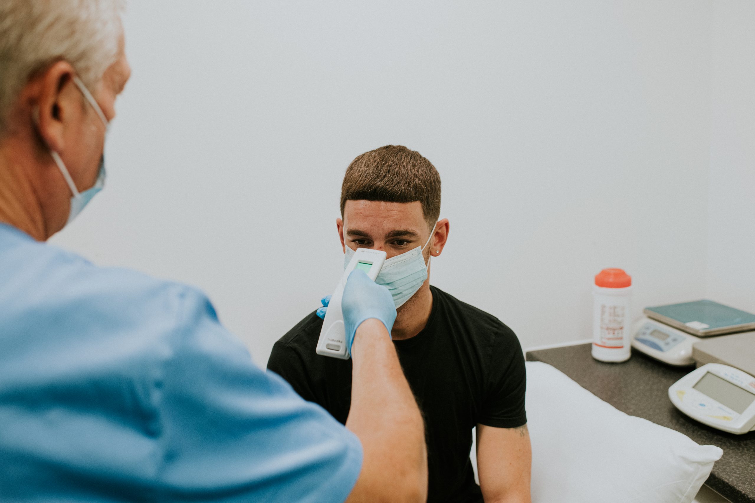 TRITEMP non-contact medical thermometer used by hospital staff for rapid fever screening during 2026 flu surge.